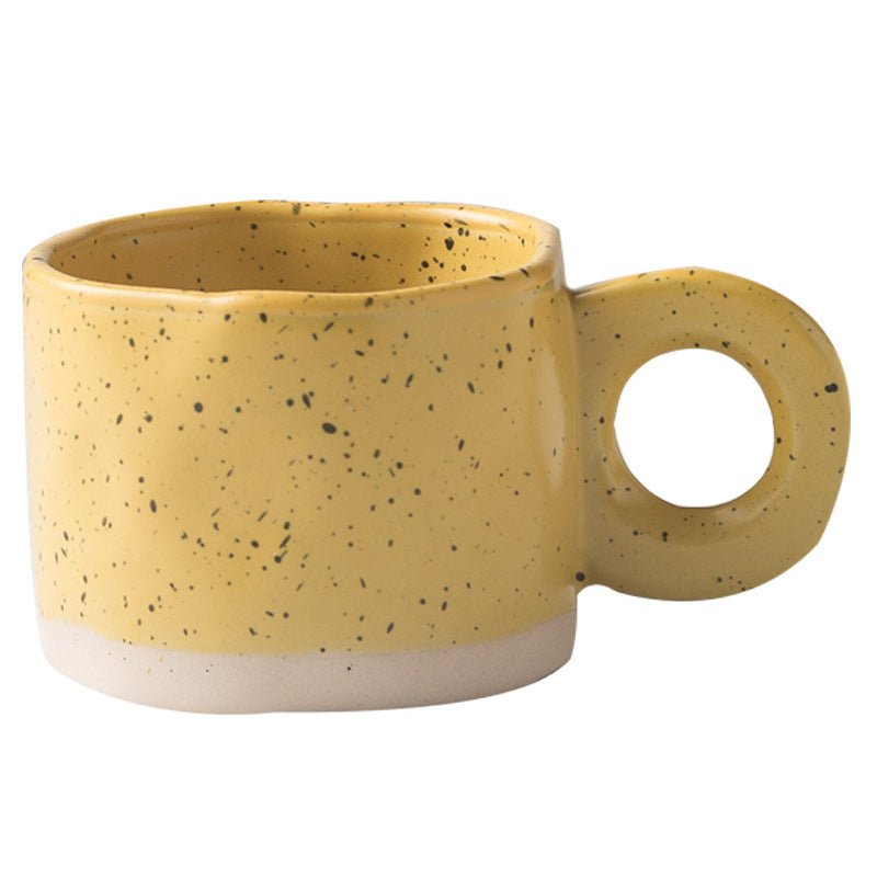 Solar Radiance Yellow ceramic coffee mug on a modern minimalist workspace desk as organic office decor.